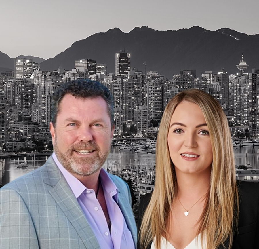 Founder and CEO stand next to each other smiling with Vancouver cityscape in background